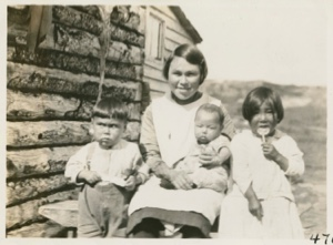 Image of young Eskimo [Inuit] mother and three children